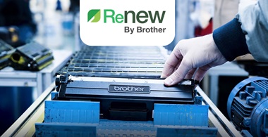 Production line of black Brother toner cartridges with a hand holding the one at the front with the Renew logo above in green