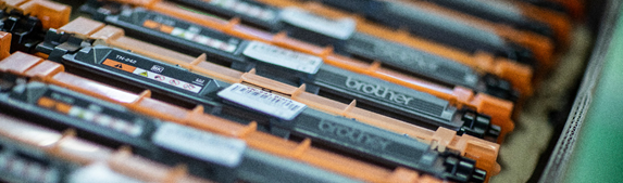 Rows of Brother cartridges in orange and black