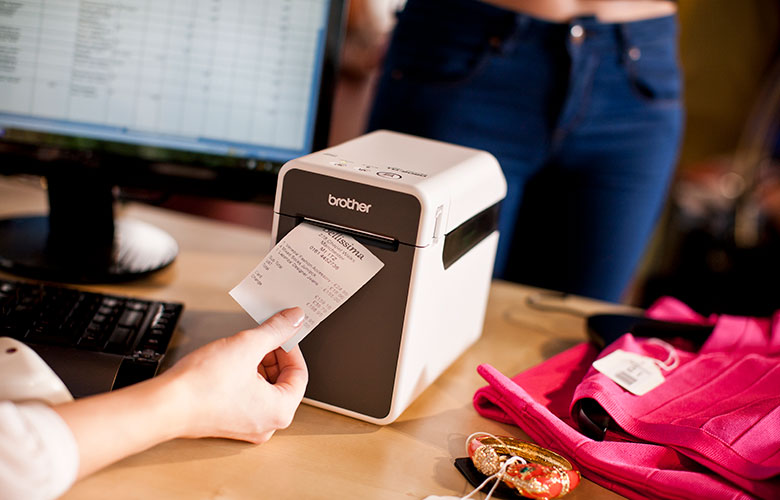 Clothes shop receipt tearing from Brother TD-2 desktop label printer